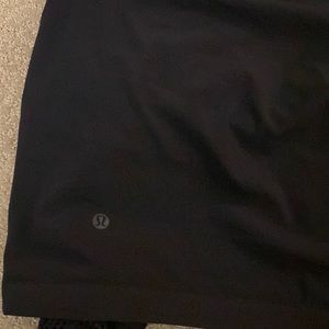 Black cropped lulu lemon hoodie with netted sleeves , workout material. Loose.